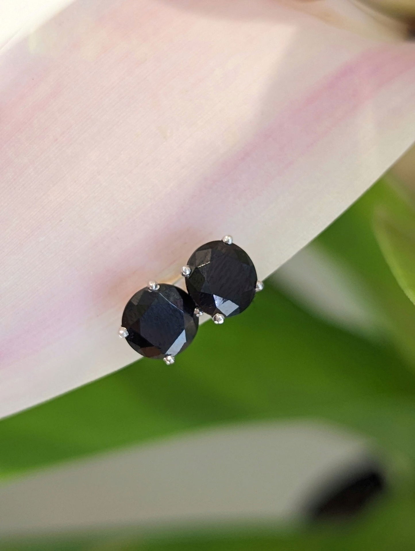 Photo of Dark Grey Spinel Studs in a decorative scene, designed by , available at Plumb Gold & Plumb Silver
