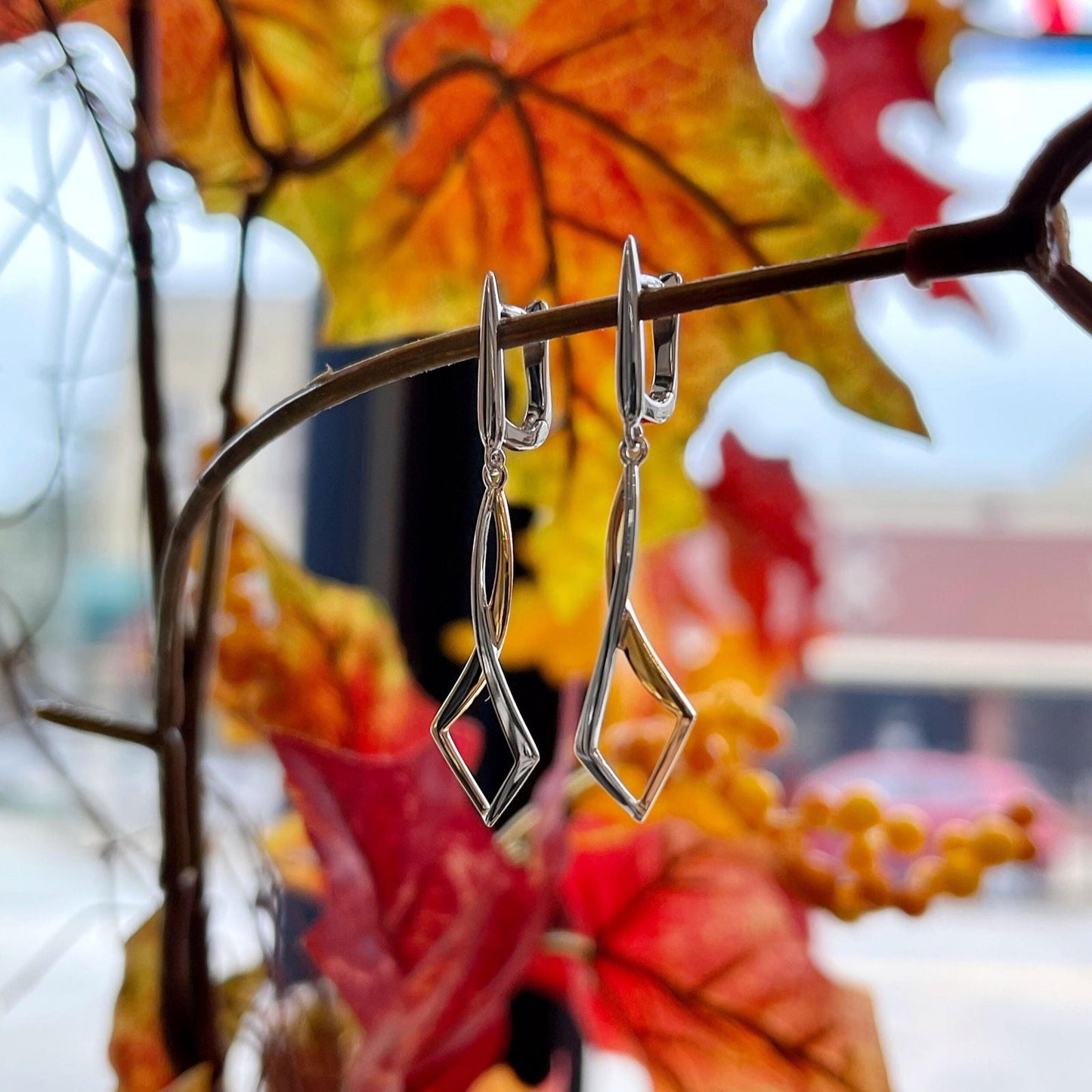 Photo of Entwined Dangles in a decorative scene, designed by , available at Plumb Gold & Plumb Silver
