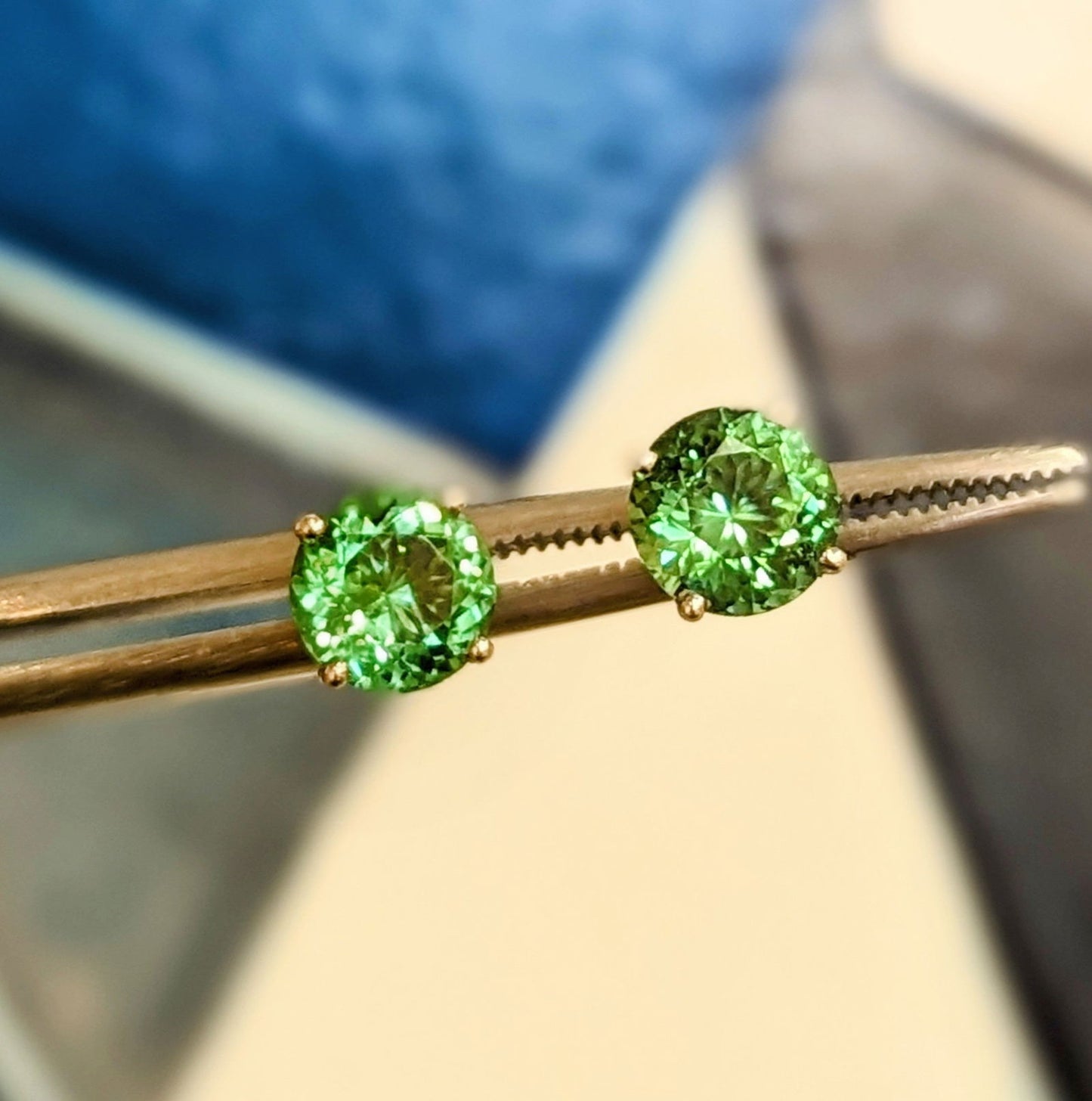 Photo of Green Tourmaline Studs in a decorative scene, designed by , available at Plumb Gold & Plumb Silver