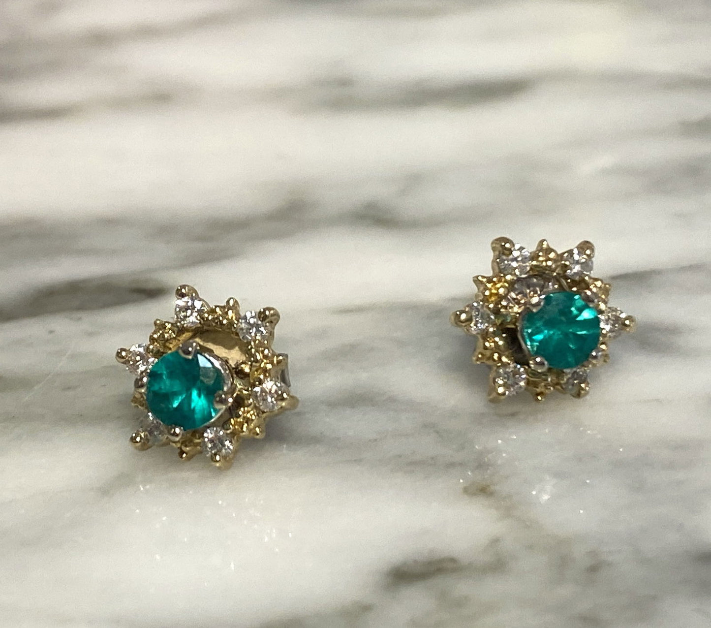 Photo of 14KY Star Diamond Earring Jackets in a decorative scene, designed by , available at Plumb Gold & Plumb Silver