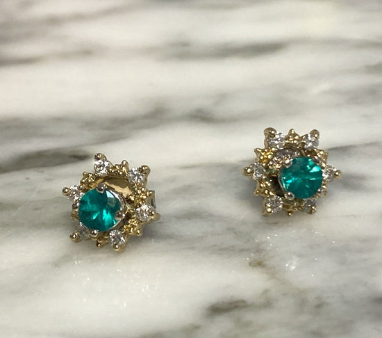 Photo of 14KY Star Diamond Earring Jackets in a decorative scene, designed by , available at Plumb Gold & Plumb Silver