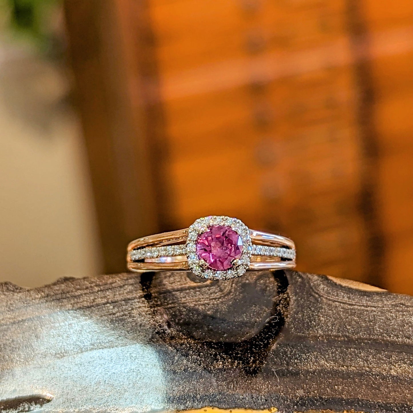 Photo of "Ainsley" Ring in a decorative scene, designed by , available at Plumb Gold & Plumb Silver