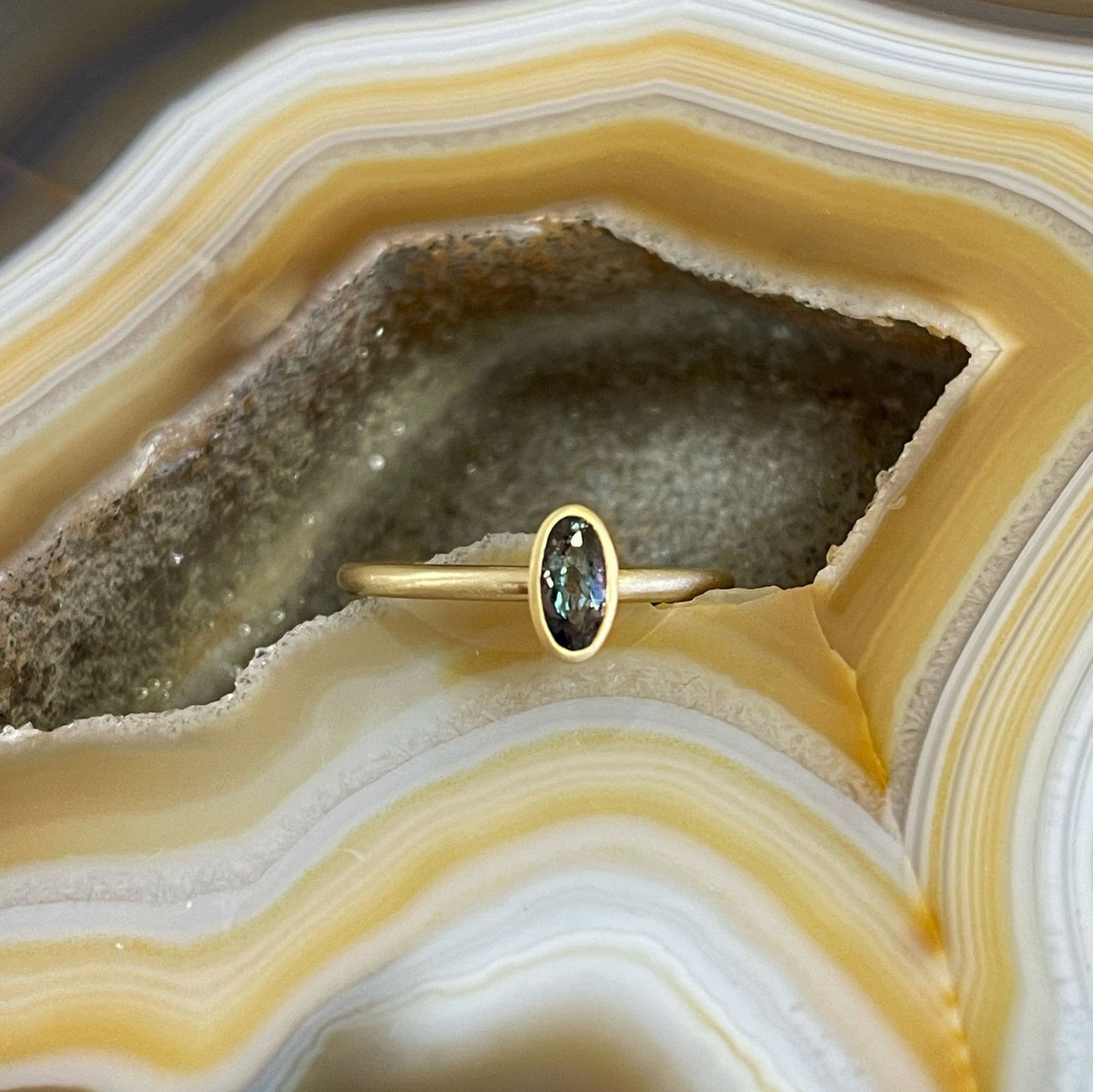 Photo of Alexandrite Yumdrop in a decorative scene, designed by , available at Plumb Gold & Plumb Silver
