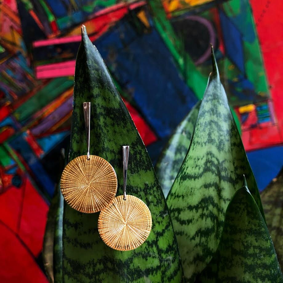 Photo of "Alhambra" Dangle Earring in a decorative scene, designed by , available at Plumb Gold & Plumb Silver