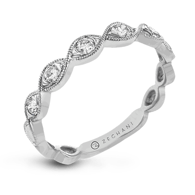 Photo of "Alicia" Twist Diamond Band in a decorative scene, designed by , available at Plumb Gold & Plumb Silver