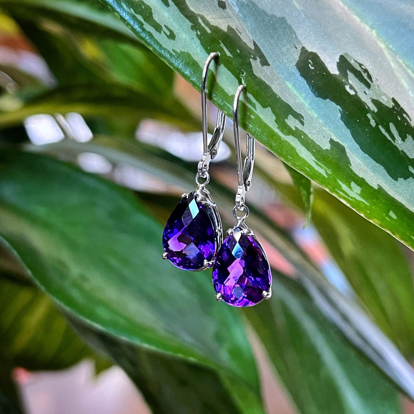 Photo of Amethyst Dangles in a decorative scene, designed by , available at Plumb Gold & Plumb Silver