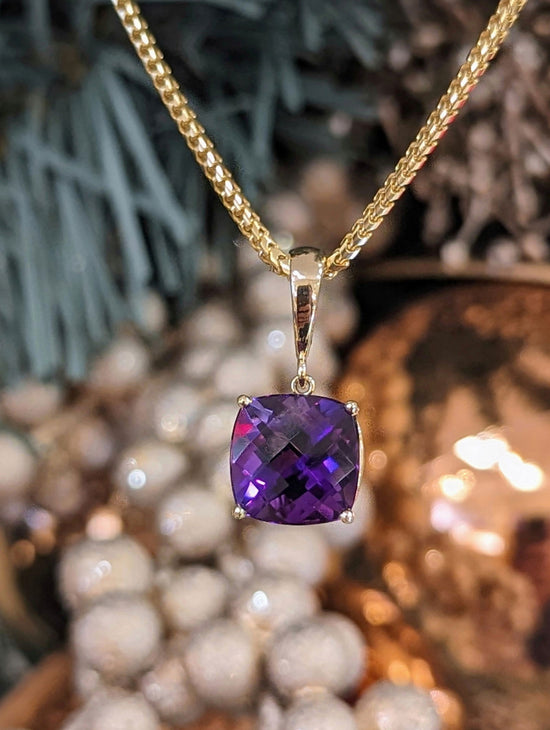 Photo of Amethyst Pendant in a decorative scene, designed by , available at Plumb Gold & Plumb Silver