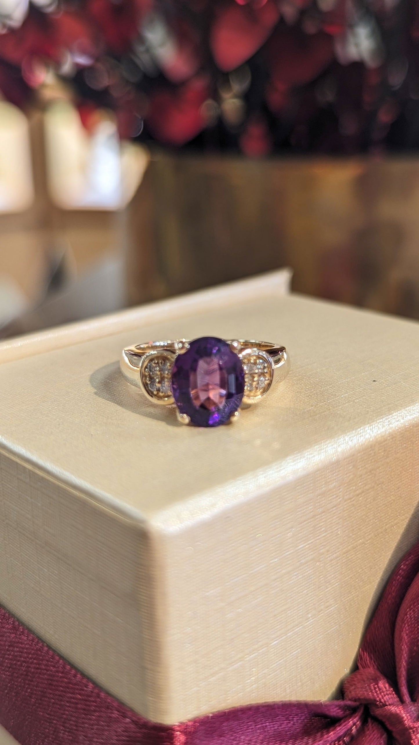 Photo of Amethyst and Diamond Ring in a decorative scene, designed by , available at Plumb Gold & Plumb Silver