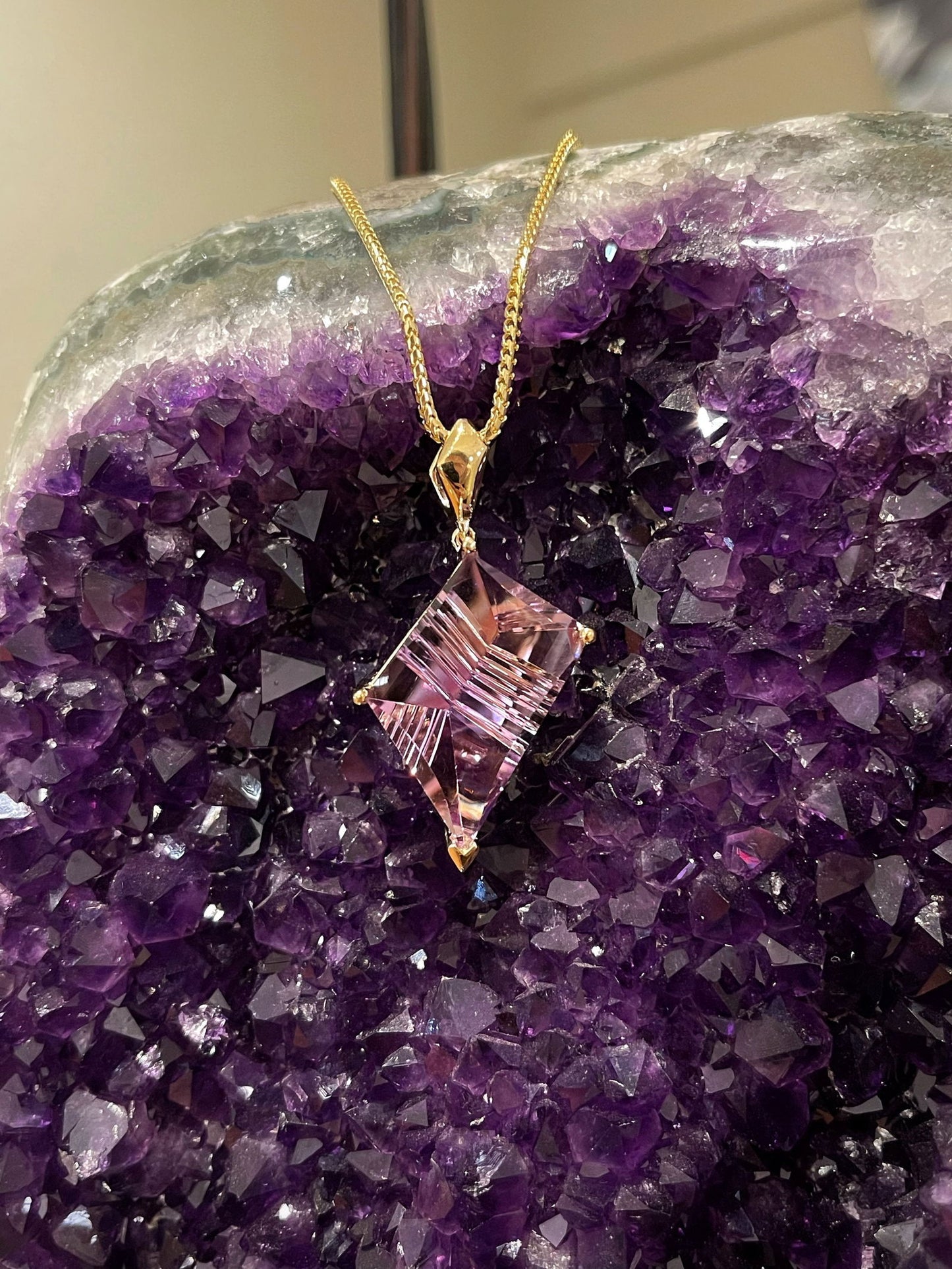 Photo of Ametrine Pendant in a decorative scene, designed by , available at Plumb Gold & Plumb Silver