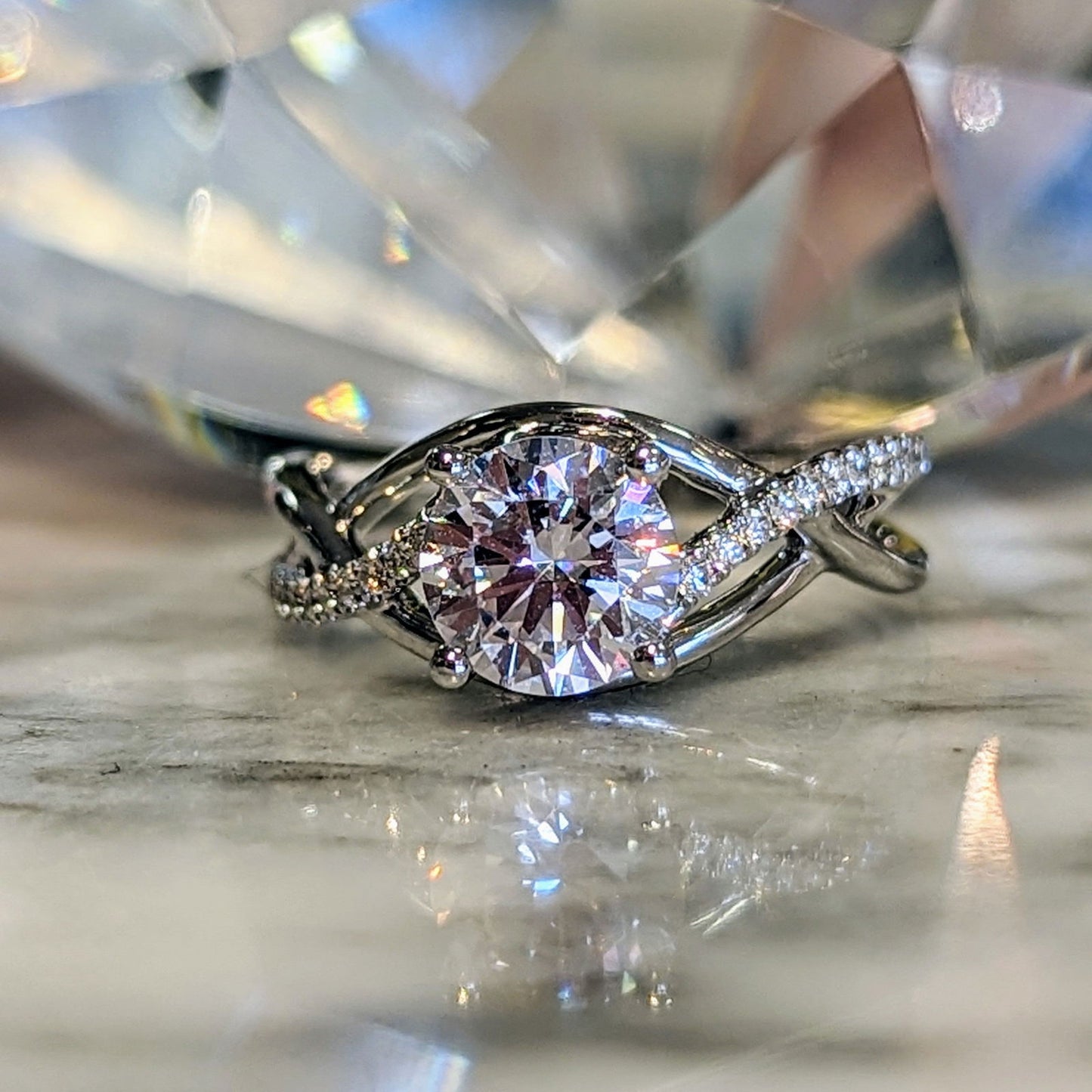 Photo of "Annalise" Woven Engagement in a decorative scene, designed by , available at Plumb Gold & Plumb Silver