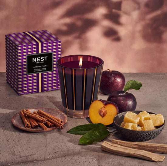 Photo of Autumn Plum Candle in a decorative scene, designed by , available at Plumb Gold & Plumb Silver