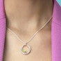 Photo of "Be-Leaf" Necklace in a decorative scene, designed by , available at Plumb Gold & Plumb Silver