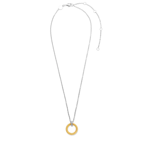 Photo of Beaded Circle Necklace in a decorative scene, designed by , available at Plumb Gold & Plumb Silver