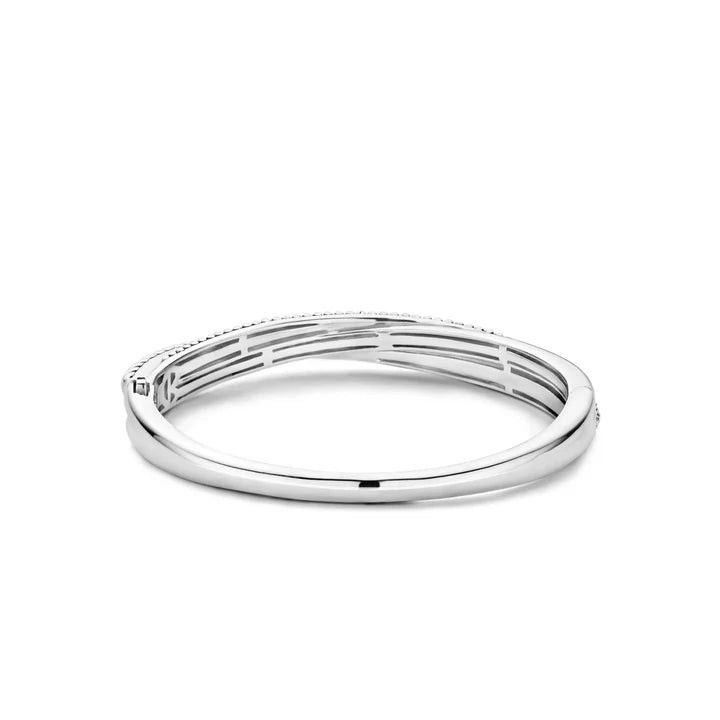 Photo of Beaded Rope Bangle in a decorative scene, designed by , available at Plumb Gold & Plumb Silver