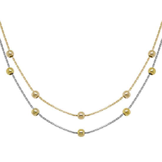 Photo of Beaded Station Chain in a decorative scene, designed by , available at Plumb Gold & Plumb Silver