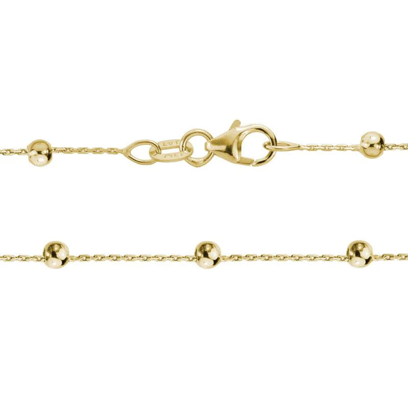 Photo of Beaded Station Chain in a decorative scene, designed by , available at Plumb Gold & Plumb Silver