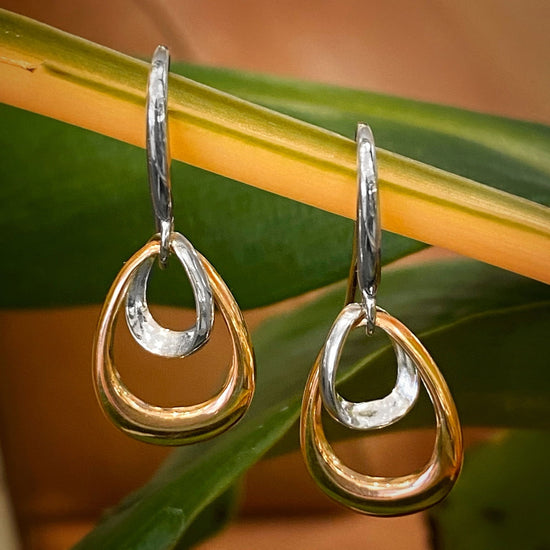 Photo of "Bell" Earrings in a decorative scene, designed by -, available at Plumb Gold & Plumb Silver