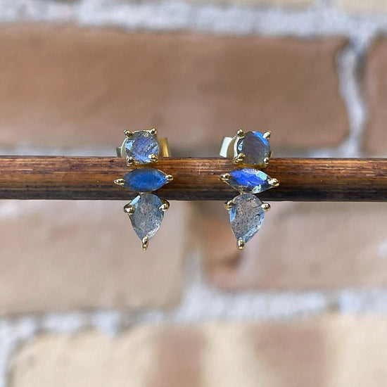 Photo of “Bella” Labradorite Studs in a decorative scene, designed by , available at Plumb Gold & Plumb Silver