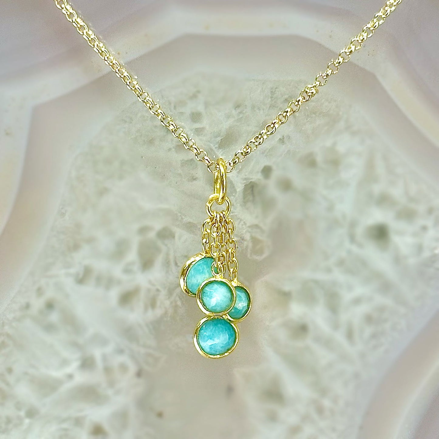 Photo of “Bella” Tassel Pendant in a decorative scene, designed by -, available at Plumb Gold & Plumb Silver