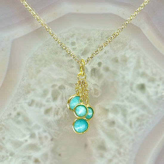 Photo of “Bella” Tassel Pendant in a decorative scene, designed by -, available at Plumb Gold & Plumb Silver