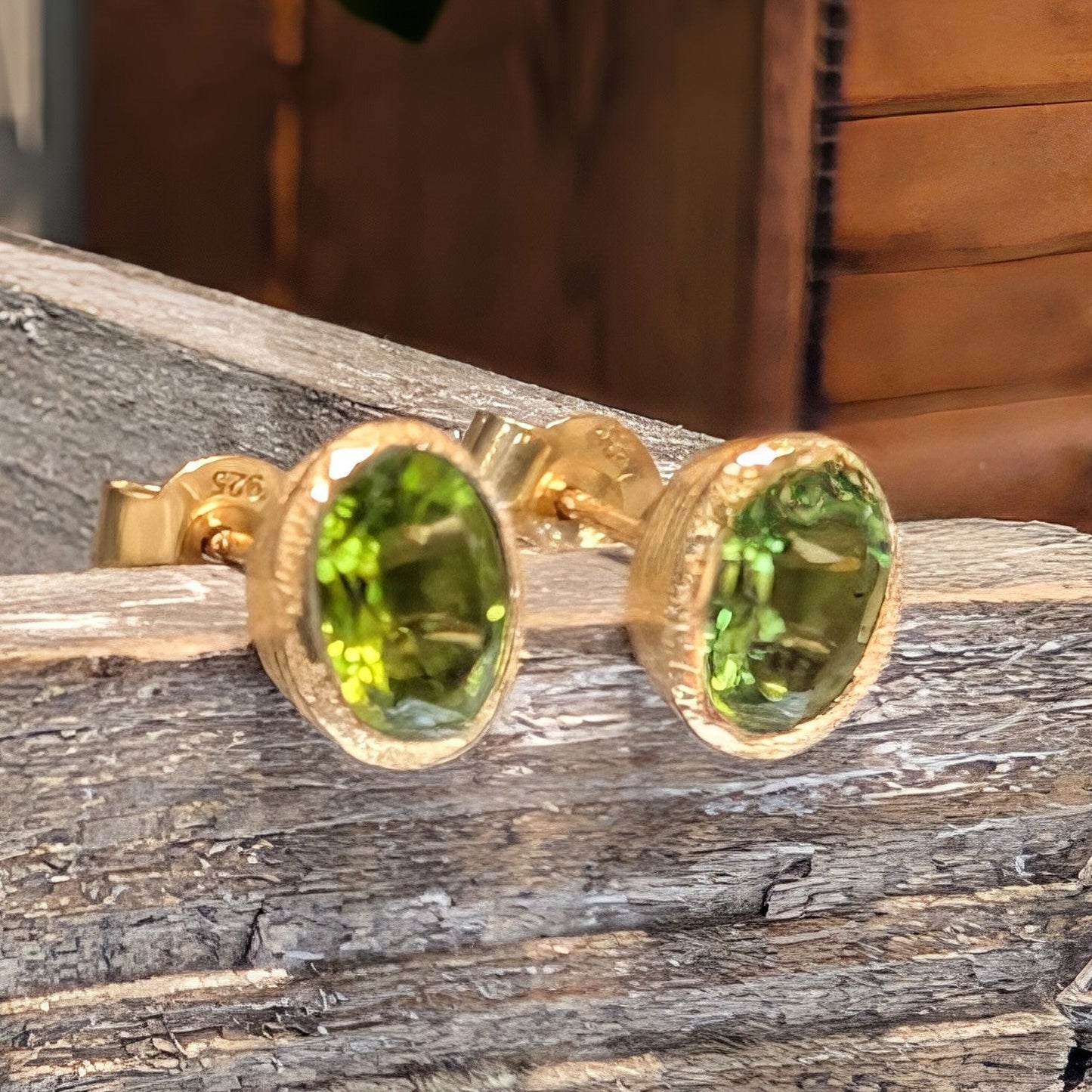 Photo of Birthstone Earrings by Jorge in a decorative scene, designed by -, available at Plumb Gold & Plumb Silver