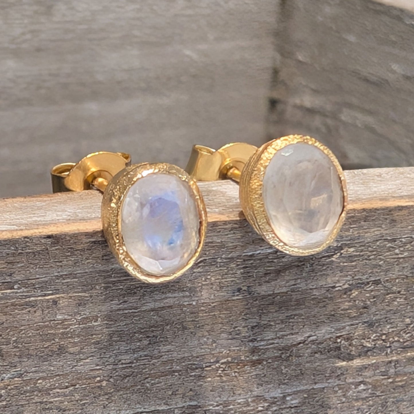 Photo of Birthstone Earrings by Jorge in a decorative scene, designed by -, available at Plumb Gold & Plumb Silver
