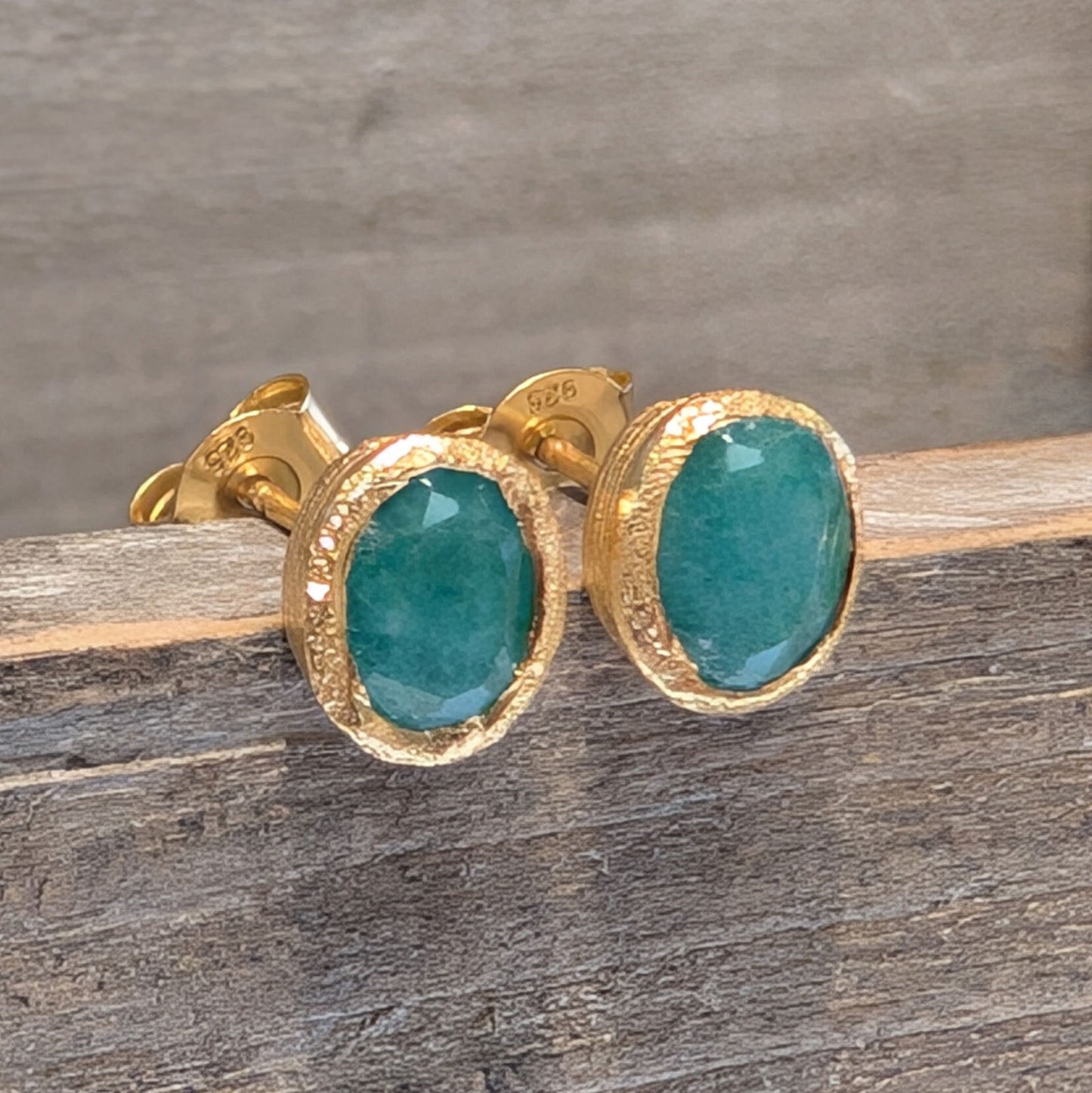 Photo of Birthstone Earrings by Jorge in a decorative scene, designed by -, available at Plumb Gold & Plumb Silver