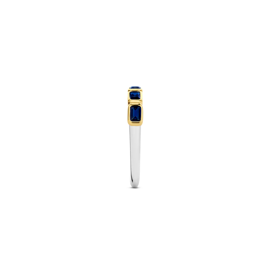 Photo of Blue Emerald-Cut Cubic Zirconia Ring in a decorative scene, designed by , available at Plumb Gold & Plumb Silver