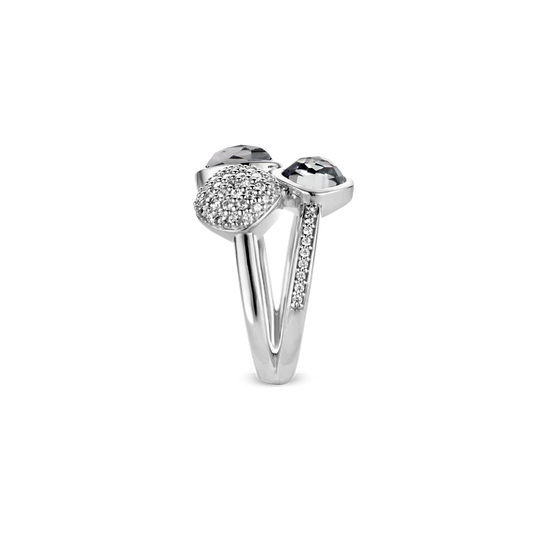 Photo of Blue Quartz and Cubic Zirconia Trio Ring in a decorative scene, designed by , available at Plumb Gold & Plumb Silver