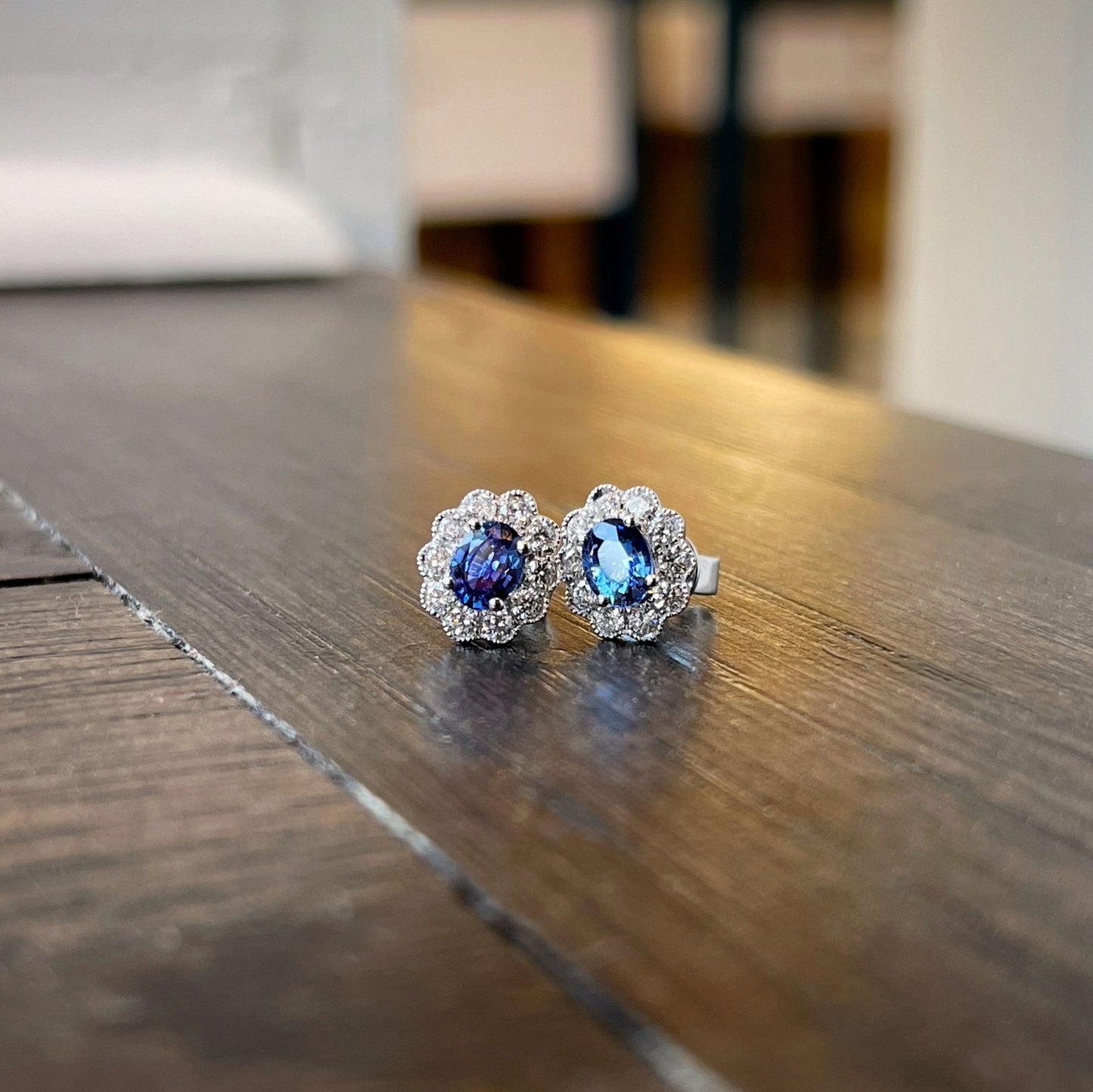 Photo of Blue Sapphire Studs in a decorative scene, designed by , available at Plumb Gold & Plumb Silver