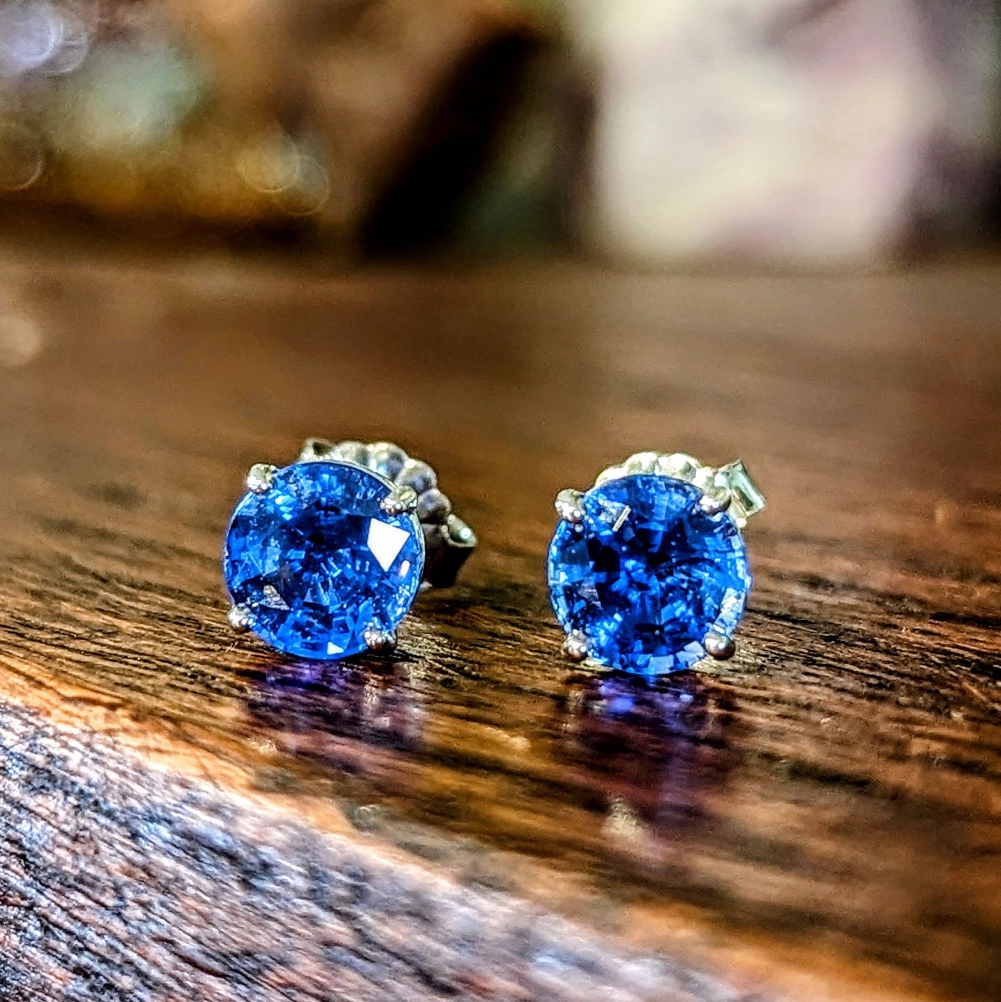 Photo of Blue Sapphire Studs in a decorative scene, designed by , available at Plumb Gold & Plumb Silver