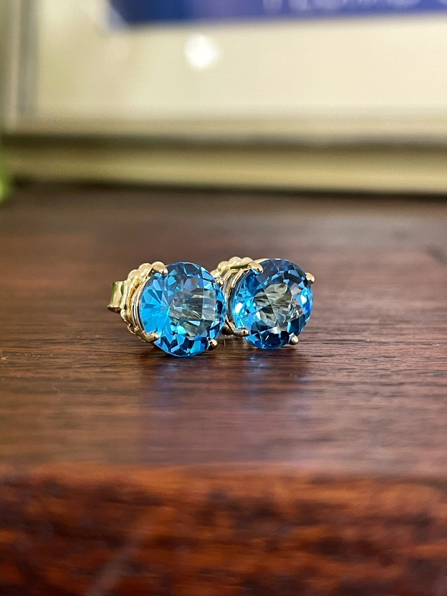 Photo of Blue Topaz Studs in a decorative scene, designed by , available at Plumb Gold & Plumb Silver