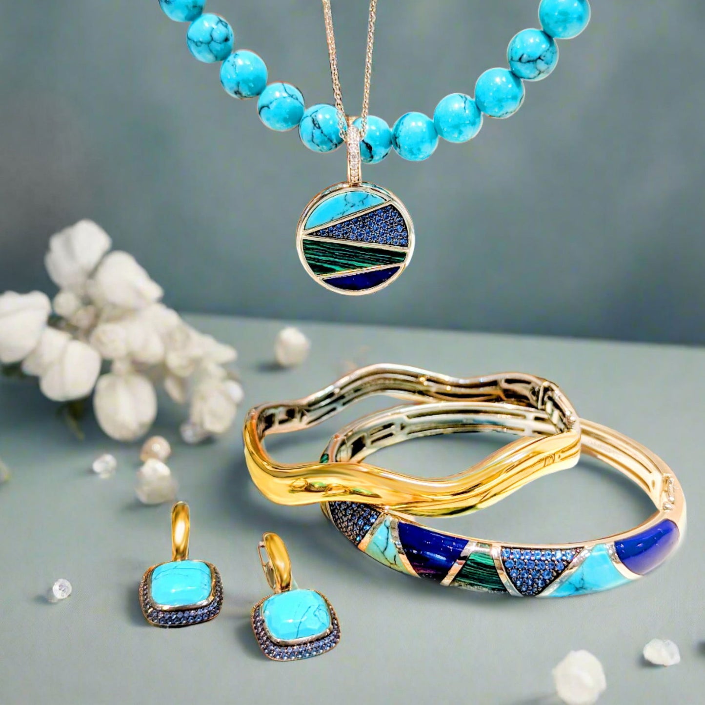 Photo of Blue and Green Inlay Necklace in a decorative scene, designed by , available at Plumb Gold & Plumb Silver