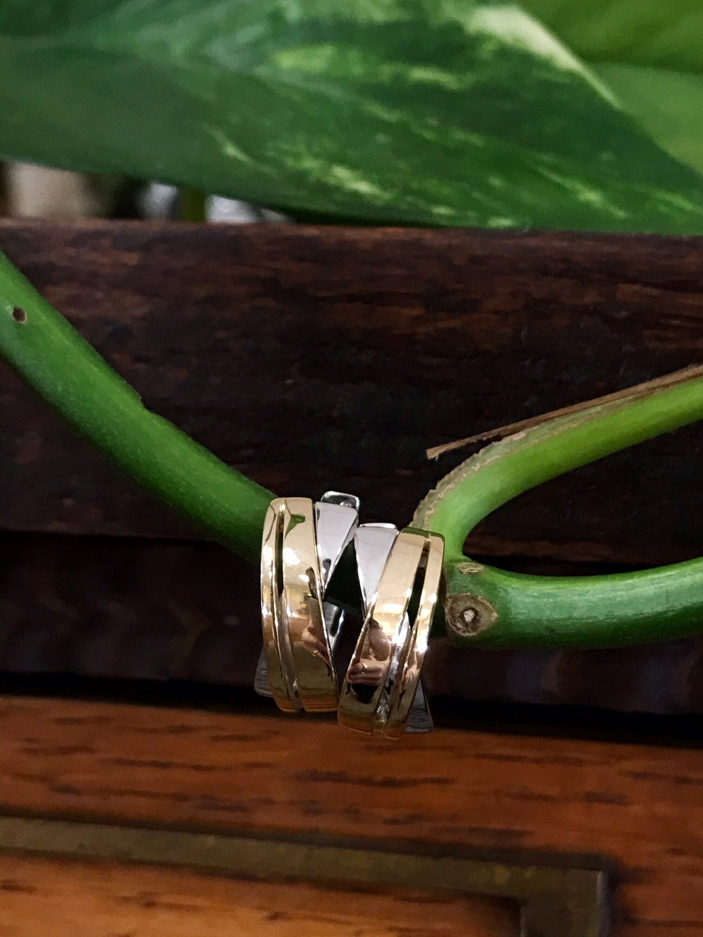 Photo of Bold Crossover Huggies in a decorative scene, designed by , available at Plumb Gold & Plumb Silver