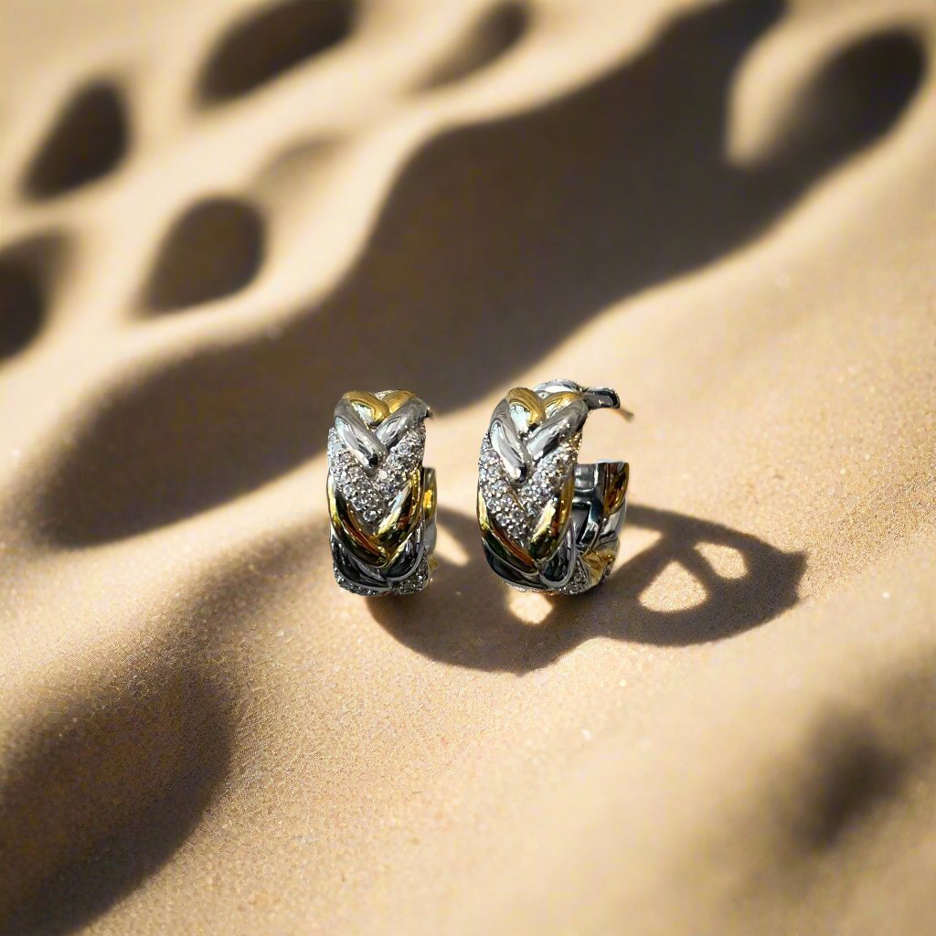Photo of Braided Link Earrings in a decorative scene, designed by , available at Plumb Gold & Plumb Silver