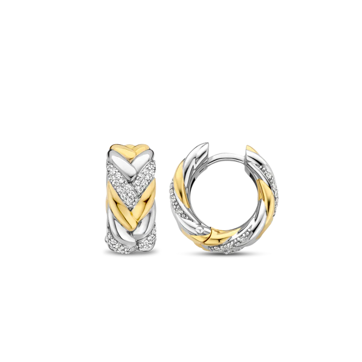 Photo of Braided Link Earrings in a decorative scene, designed by , available at Plumb Gold & Plumb Silver