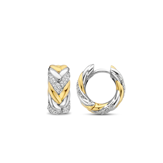 Photo of Braided Link Earrings in a decorative scene, designed by , available at Plumb Gold & Plumb Silver