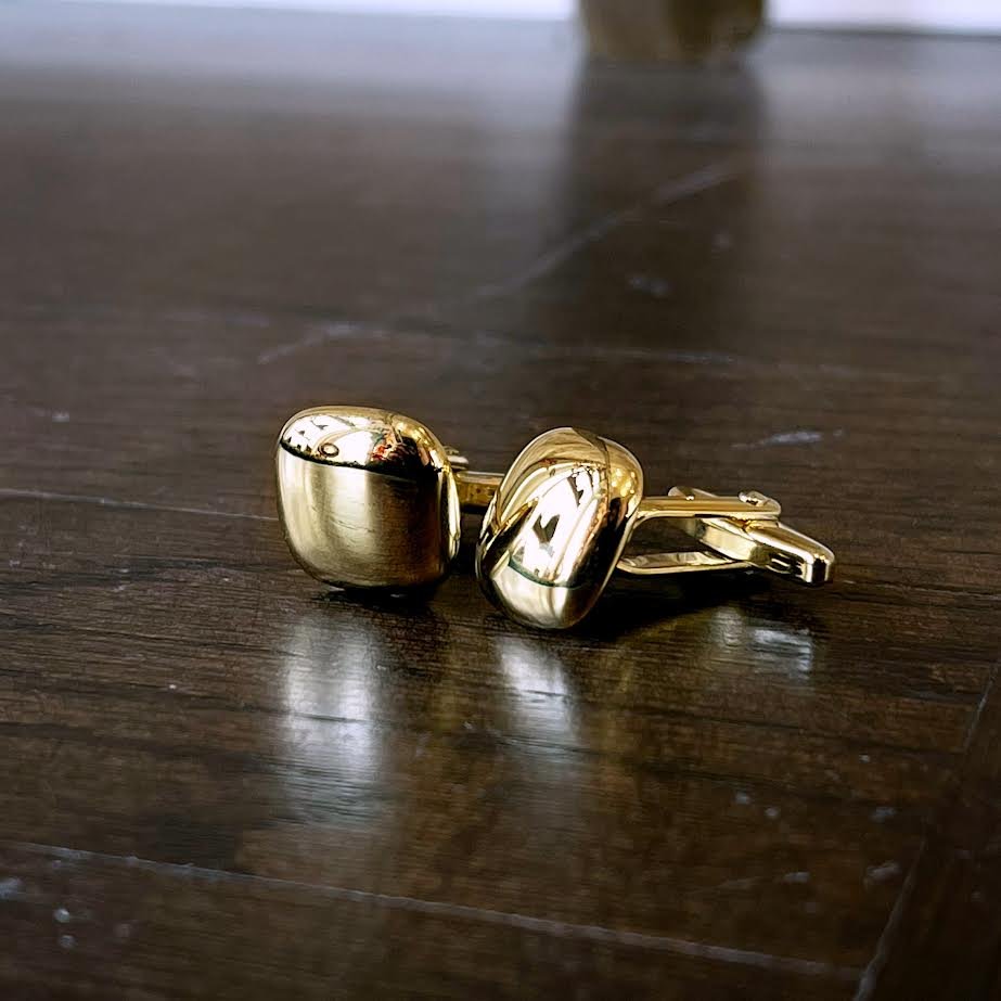 Photo of Breuning Cufflinks in a decorative scene, designed by , available at Plumb Gold & Plumb Silver