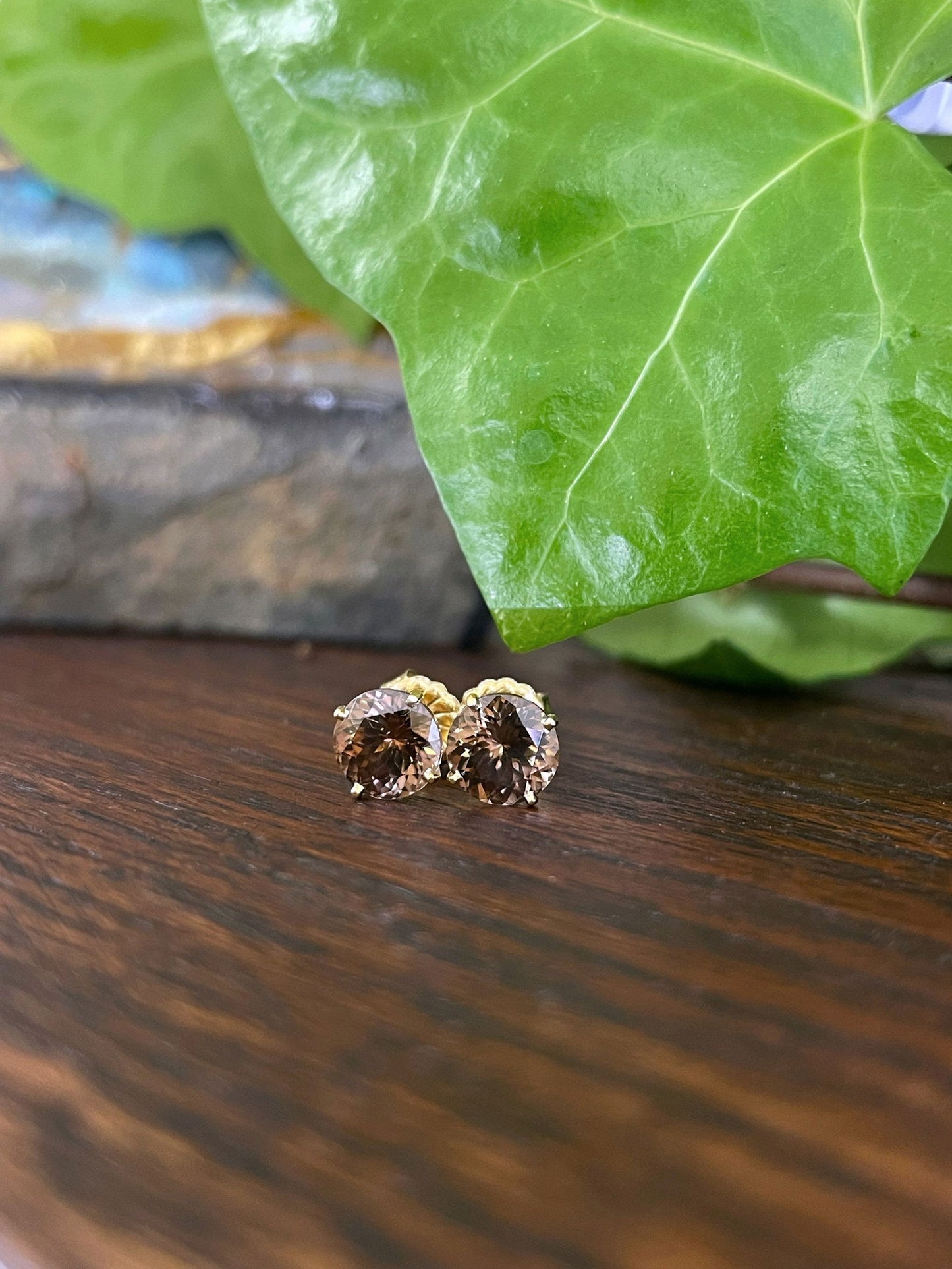 Photo of Brown Zircon Studs in a decorative scene, designed by , available at Plumb Gold & Plumb Silver