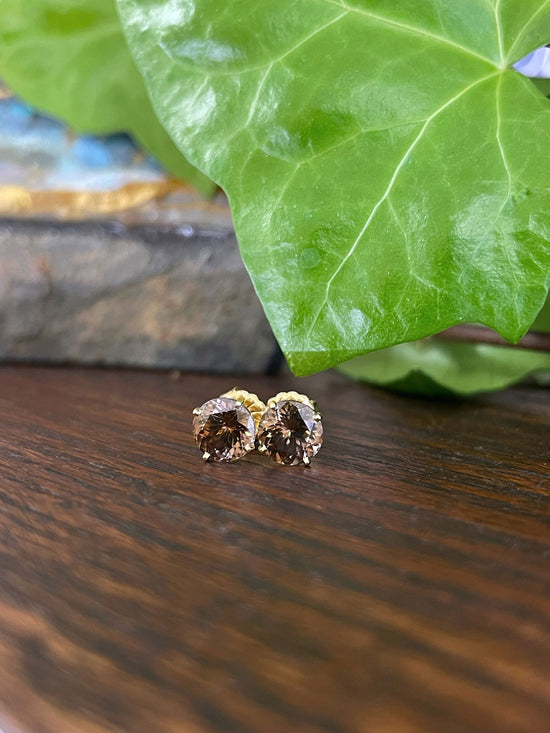 Photo of Brown Zircon Studs in a decorative scene, designed by , available at Plumb Gold & Plumb Silver