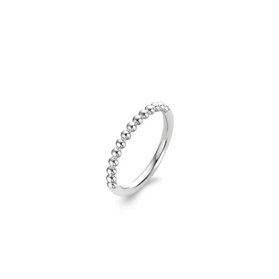 Photo of Bubbles Ring in a decorative scene, designed by , available at Plumb Gold & Plumb Silver