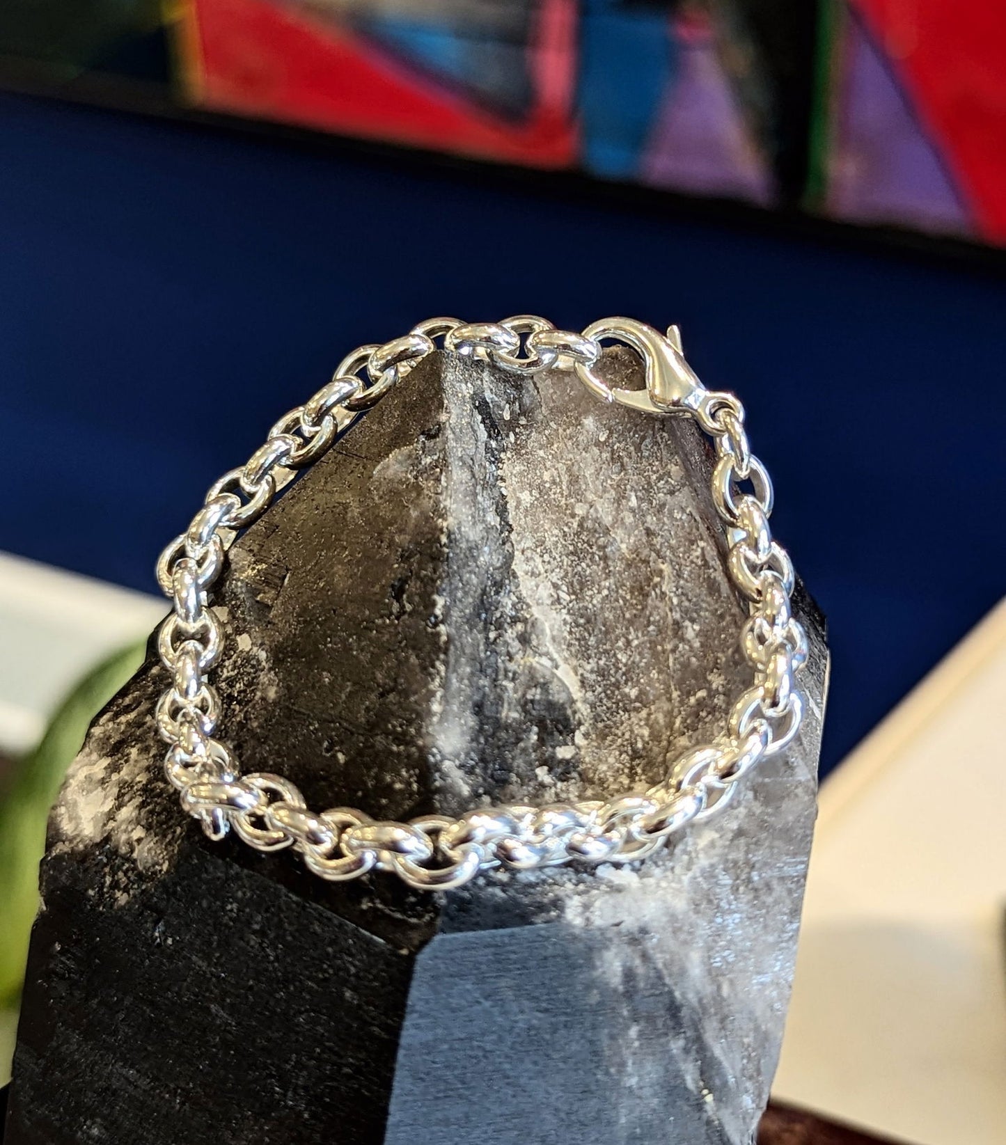 Photo of Cable Link Bracelet in a decorative scene, designed by , available at Plumb Gold & Plumb Silver