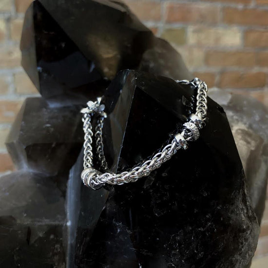 Photo of Cable Link Bracelet with Diamond Accents in a decorative scene, designed by , available at Plumb Gold & Plumb Silver
