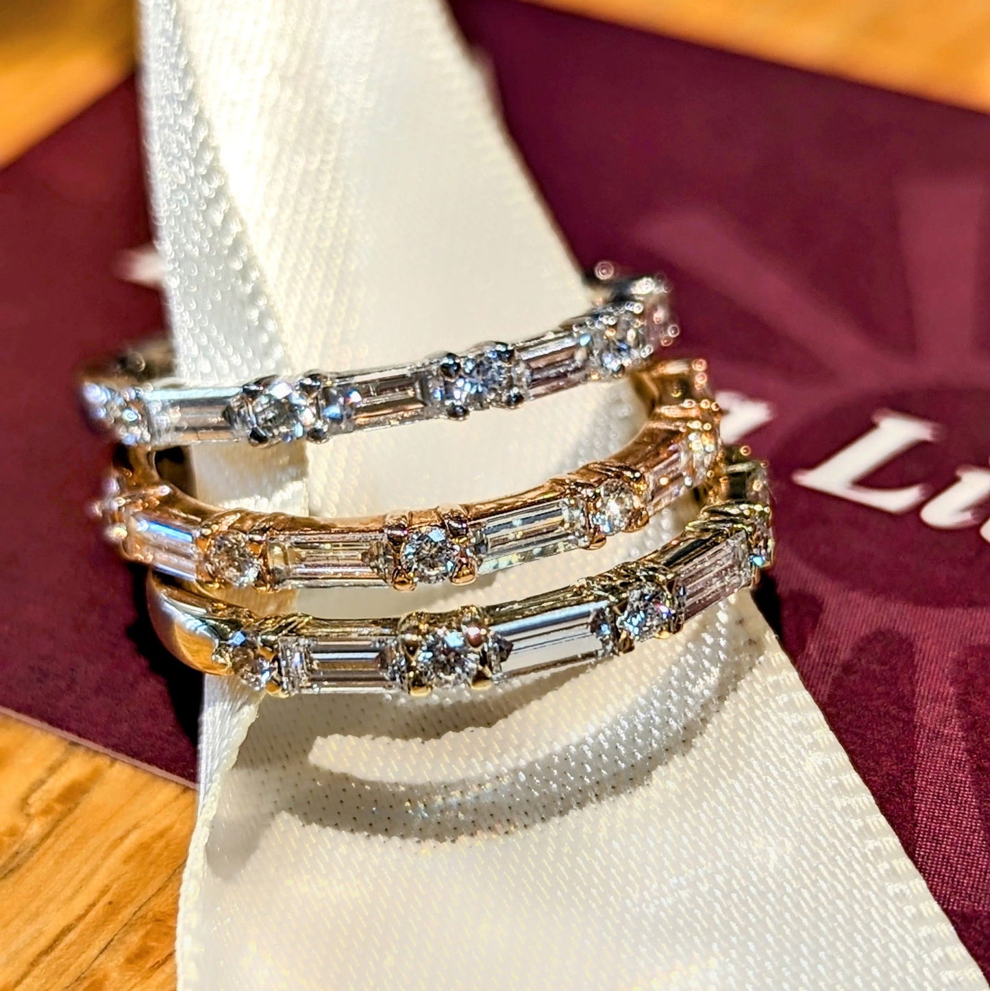 Photo of "Camille" Band in a decorative scene, designed by , available at Plumb Gold & Plumb Silver