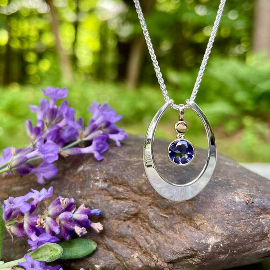 Photo of "Caprice" Pendant in a decorative scene, designed by , available at Plumb Gold & Plumb Silver