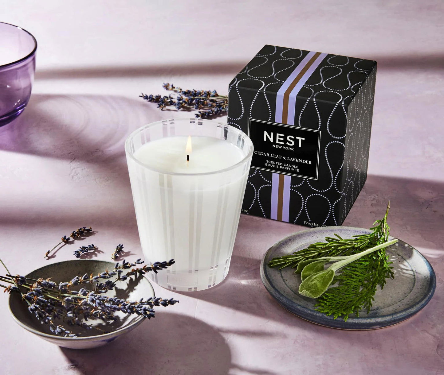 Photo of Cedar Leaf & Lavender Candle in a decorative scene, designed by , available at Plumb Gold & Plumb Silver