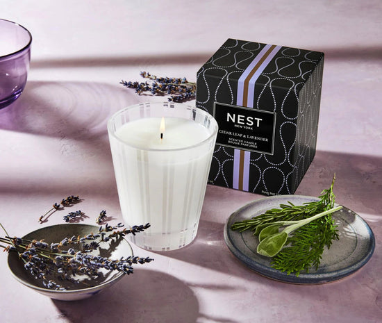 Photo of Cedar Leaf & Lavender Candle in a decorative scene, designed by , available at Plumb Gold & Plumb Silver