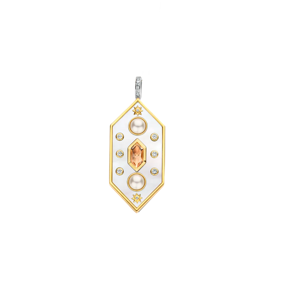 Photo of Celestial Large Hexagon Mother of Pearl Pendant in a decorative scene, designed by , available at Plumb Gold & Plumb Silver