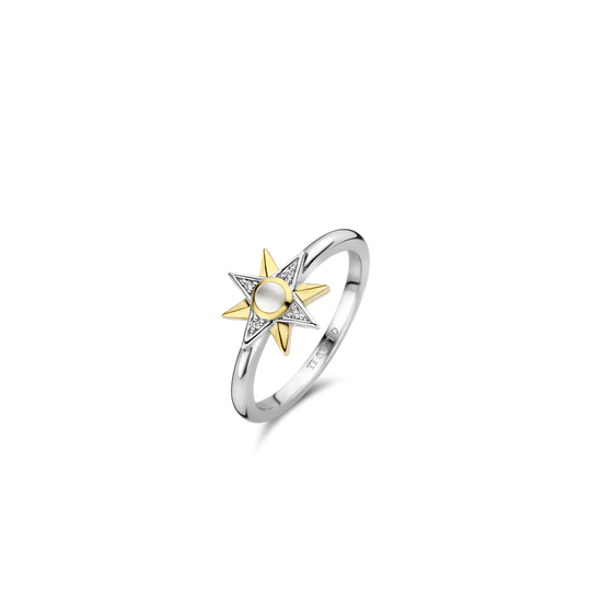 Photo of Celestial Star Ring in a decorative scene, designed by , available at Plumb Gold & Plumb Silver