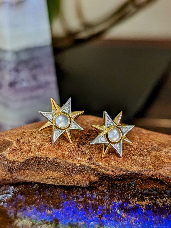 Photo of Celestial Stud Earring in a decorative scene, designed by , available at Plumb Gold & Plumb Silver